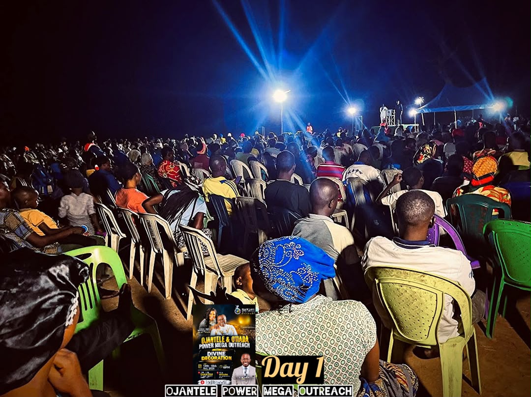 Crowd seated facing the stage on Day 1 of the outreach